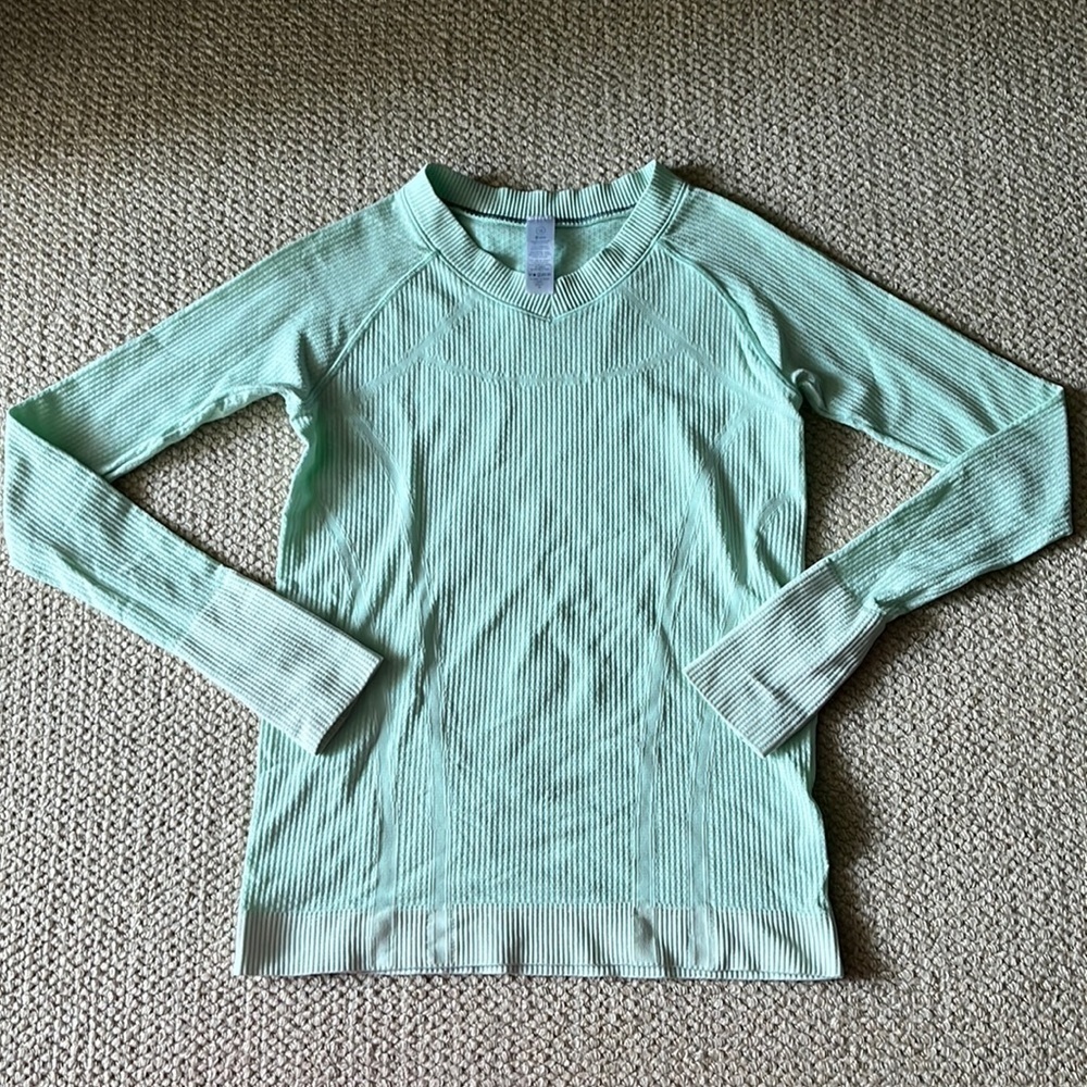 Light green Ivivva long sleeve shirt with thumb holes​